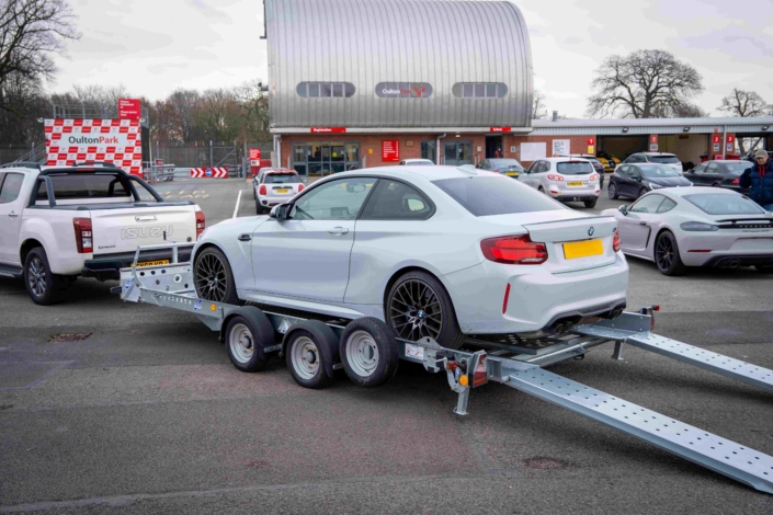 Ct157 With Bmw In Car Park Skids Down Oulton Park Branding In View